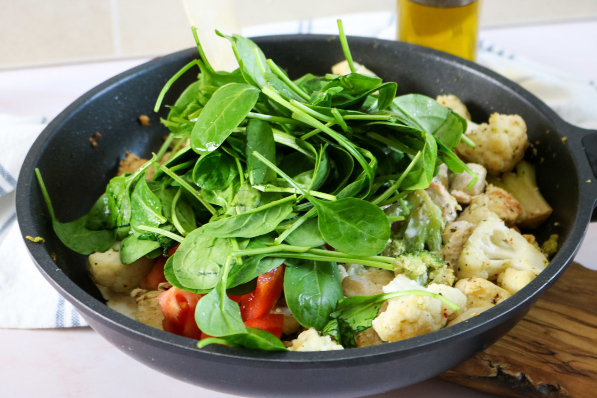 Keto Garlic Chicken With Broccoli, Cauliflower, and Spinach Stir Fry