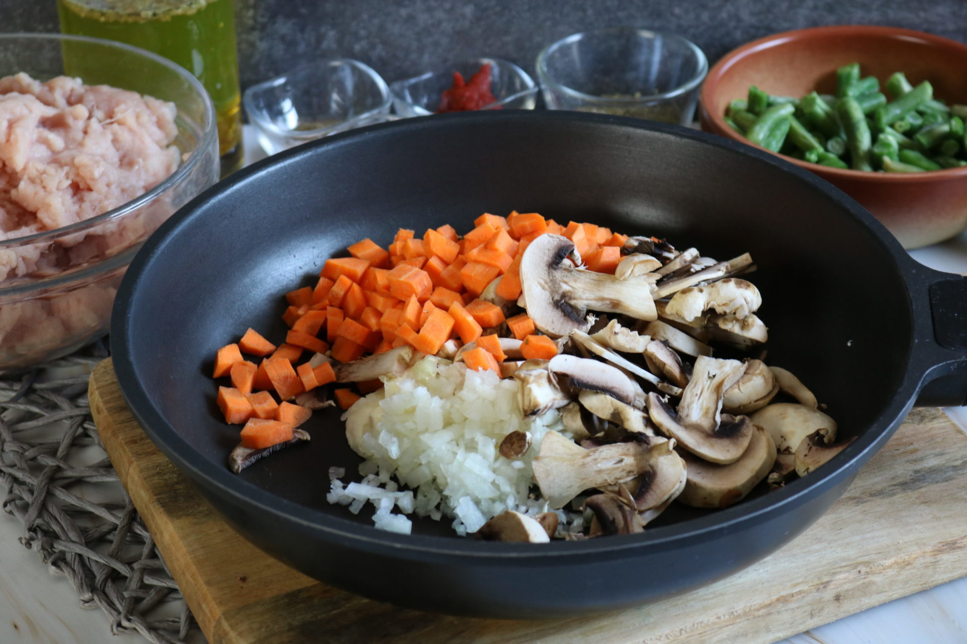 skillet with vegetables in it, ready to cook