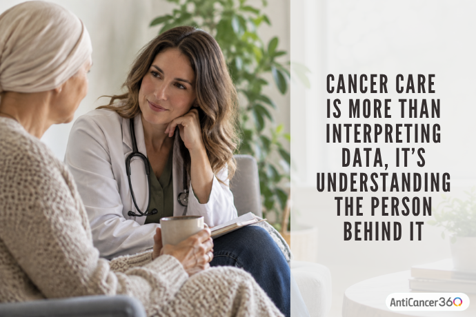 Doctor speaking with a patient, illustrating how personalized cancer care involves understanding the person behind the diagnosis, not just interpreting medical data.