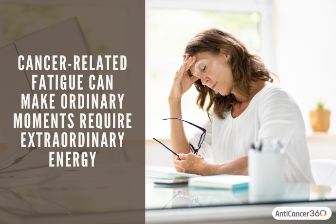 Woman sitting quietly at a kitchen table, reflecting the physical exhaustion of cancer-related fatigue.