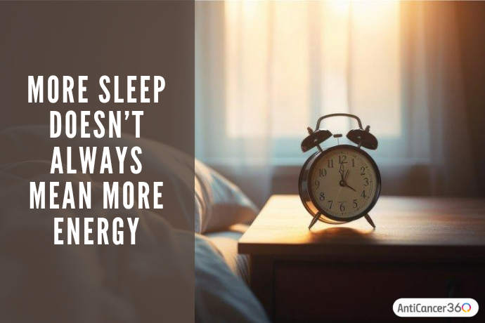 Alarm clock beside a bed representing how more sleep does not always relieve cancer-related fatigue.